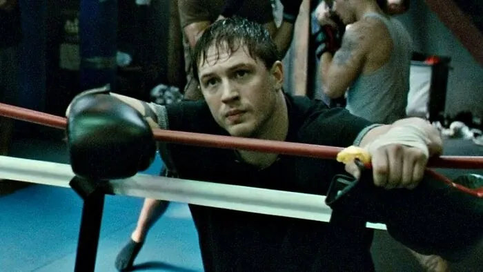 Tommy wearing boxing gloves 