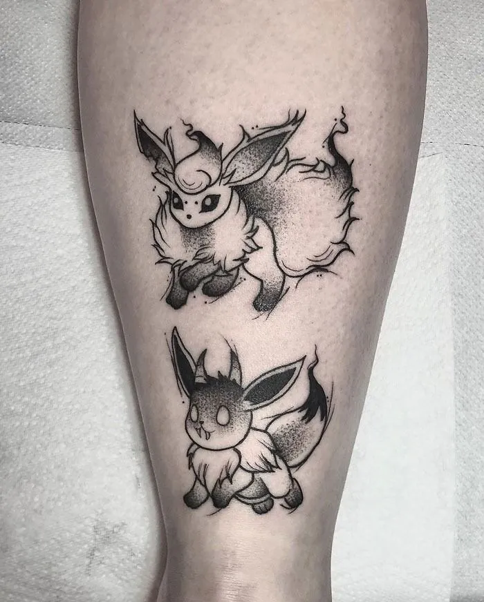 Unique calf tattoo featuring stylized ink characters, showcasing cool design elements.