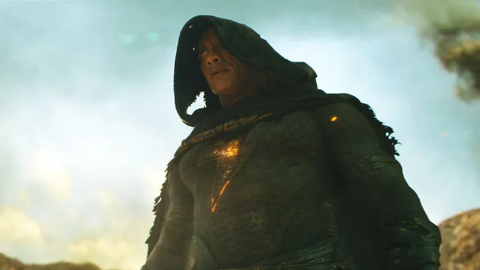 Actor in a dark hooded costume portraying a superhero, representing highest-paid actors in action and fantasy films.