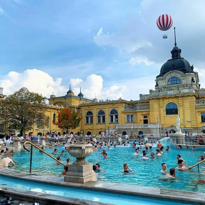 Big public city pool with people inside