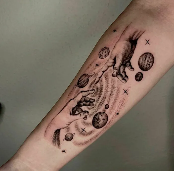 Planets In Space Forearm Tattoo
