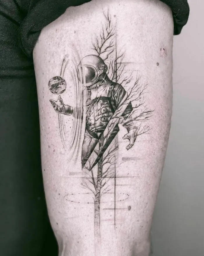 Astronaut And Tree Arm Tattoo