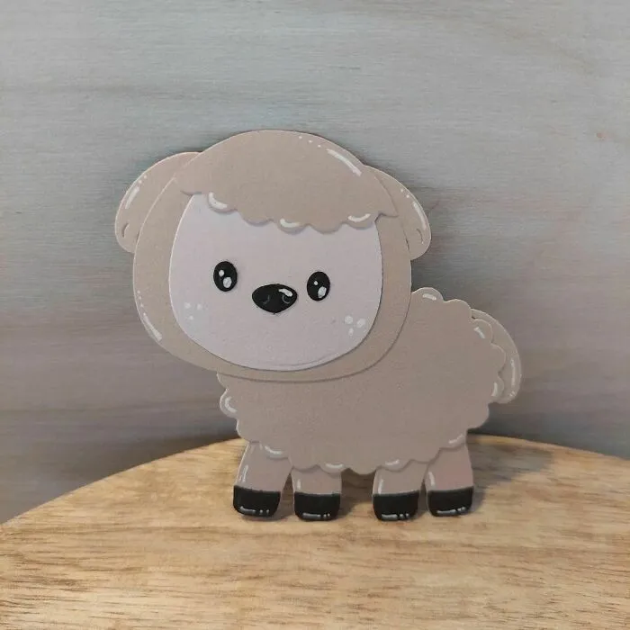 a sheep made out of a paper 
