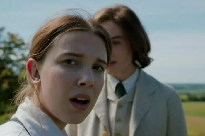 Close-up of two actors outdoors, portraying emotional expressions, representing highest-paid actors in a film scene.