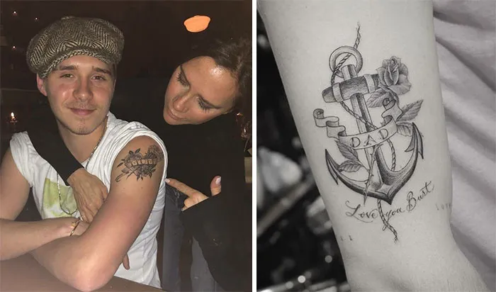 Two people admire a tattoo of a ship, with a close-up of an anchor tattoo labeled "Dad" with roses.