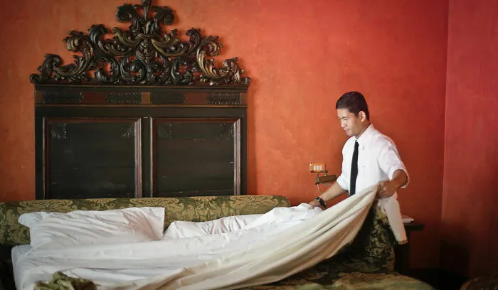 Person changing sheets