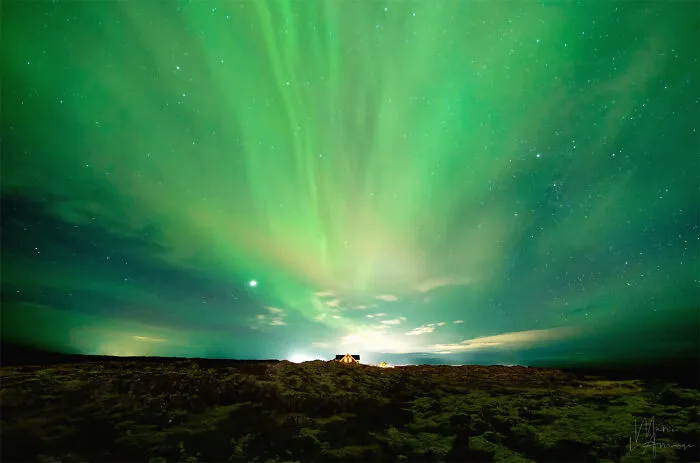 Northern Lights Above A Cabin Lost In The Middle Of A Lava Field, Iceland