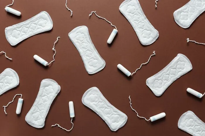 Disposable Pads And Tampons Scattered On Ground 