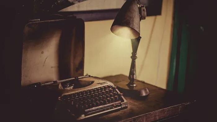 Typewriter on the wooden table 
