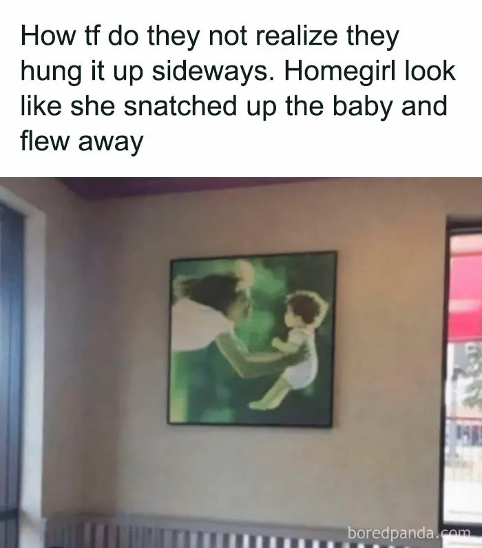 Sideways photo on wall looks like a humorous optical illusion, resembling a person flying with a child.