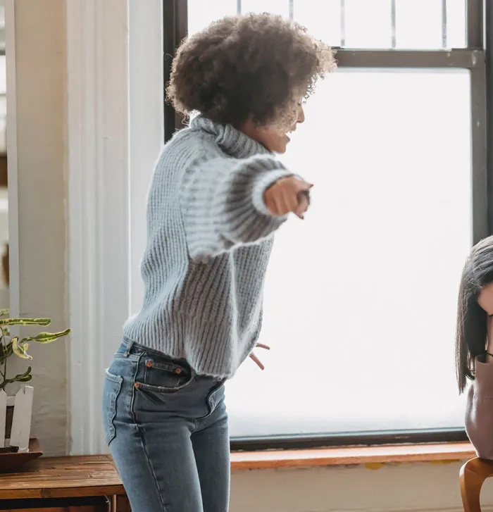 Child pointing and yelling, illustrating hurtful comments effect in a family setting.