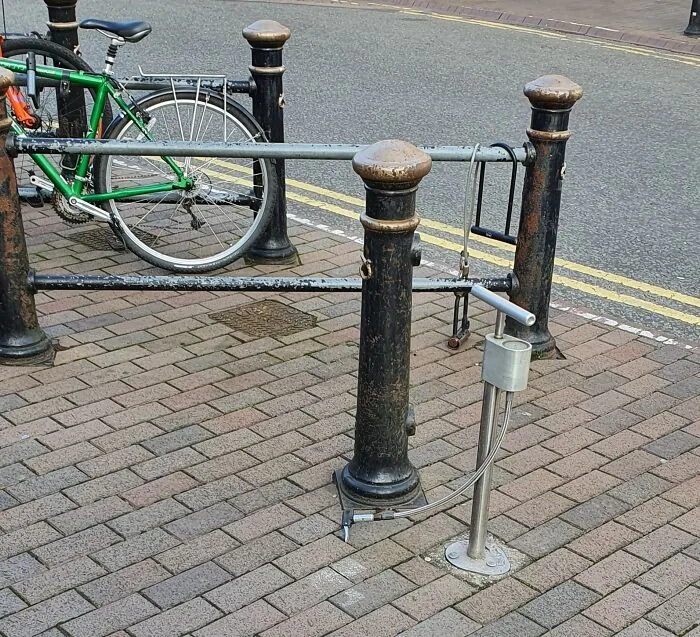 A Bike Pump Permanently Installed Next To The Bike Lock-Up Area