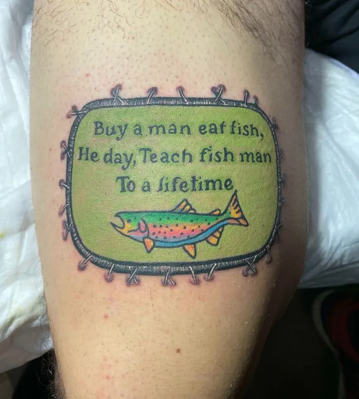 Colorful tattoo with a humorous fish-themed quote on skin, incorporating main word tattoos design.