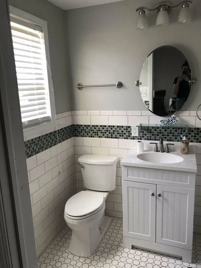 "Stylish bathroom with modern vanity and round mirror for home decoration."
