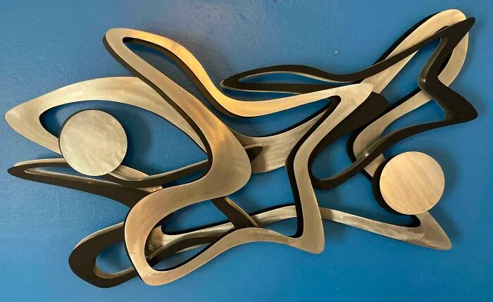 Metal wall art sculpture on the wall 