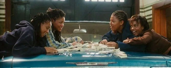 Four friends smiling and leaning over a car hood covered with money, symbolizing iconic best friend duos.