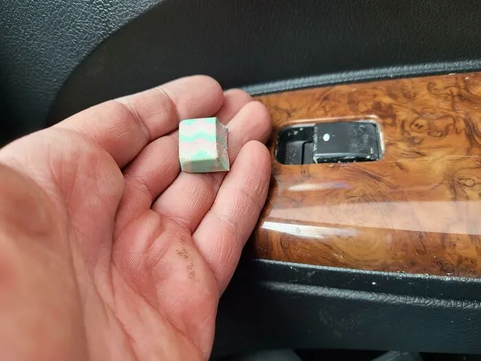 The Piece Of An Eraser That I Cut To Fit My Window Switch So My Dog Would Stop Randomly Rolling Down The Window