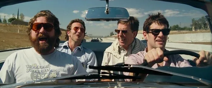 Four best friends in a car, sharing a joyful moment, representing iconic friendship.