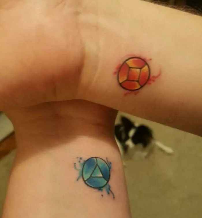 Colorful wrist tattoo designs featuring circular geometric patterns.
