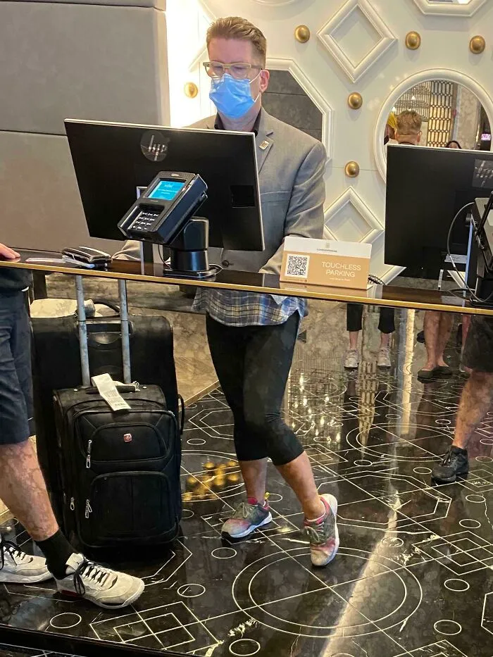 Funny reflection of a man with woman legs 