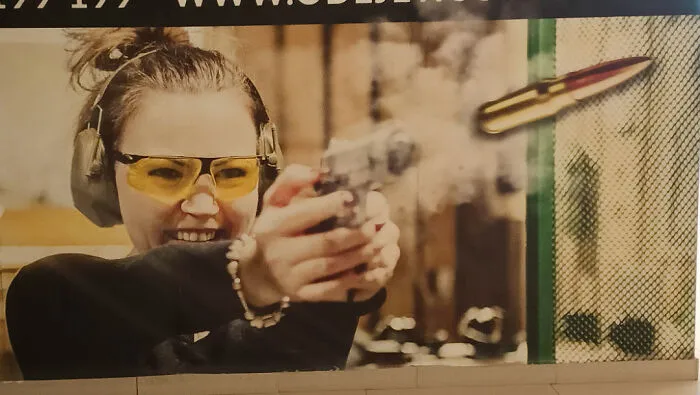 This Shooting Range Ad That Shows A Gun Firing A Cartridge