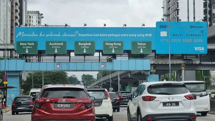 Ad On The Road That Imitates Real Street Signs