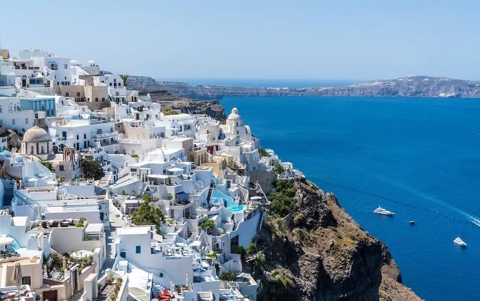 White buildings on the rocky mountain above the sea 
