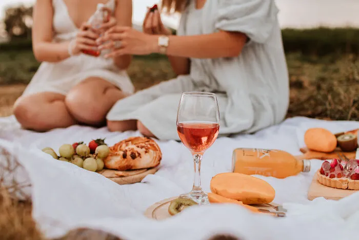 A glass of wine on the white shit 