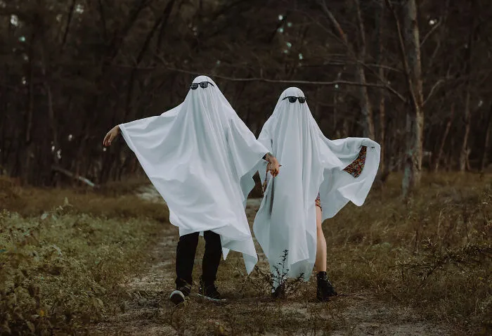 People wearing white shits pretending to be a ghost 