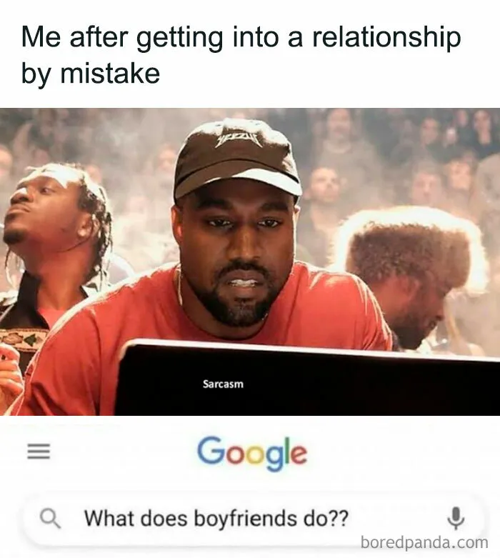 Man looking confused at a computer screen with sarcastic text: "What does boyfriends do?"