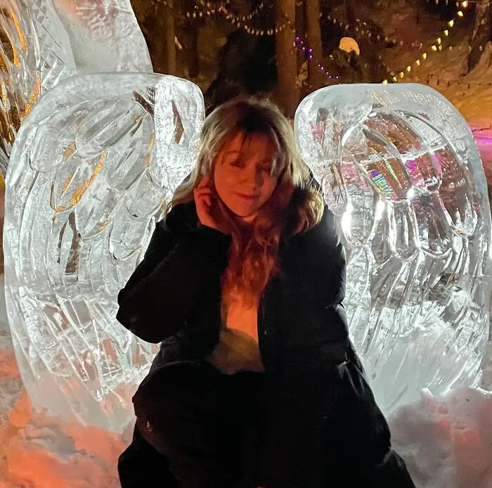 Me Trying To Be Funny In Front Of Some Ice-Carved Angel Wings Lol
