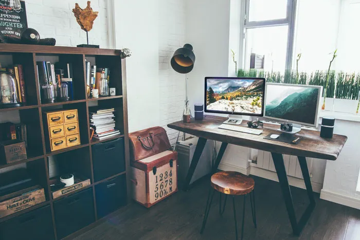 Home decoration ideas featuring a stylish office with a wooden desk, modern decor, and a bookshelf.