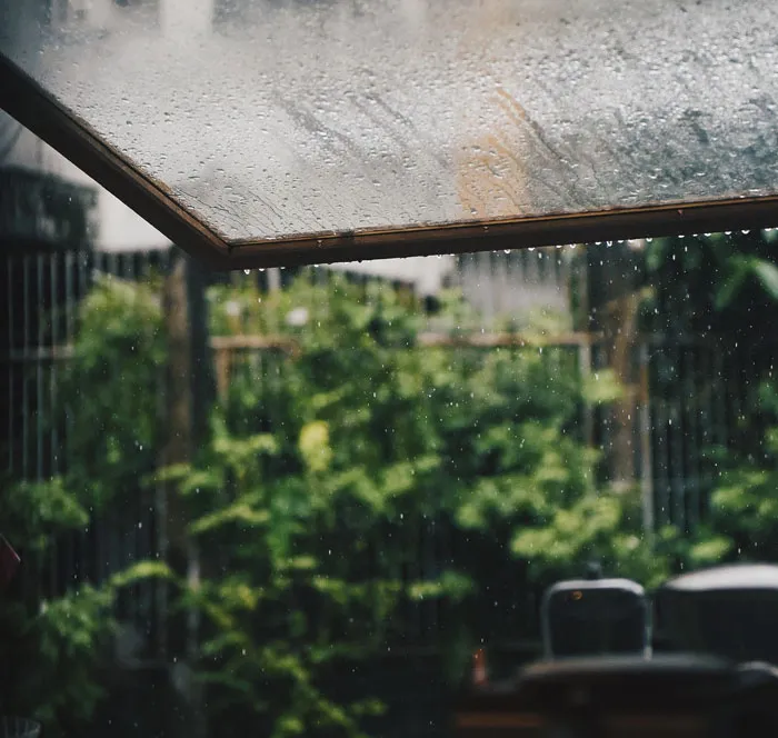 Rain drops falling from the roof 