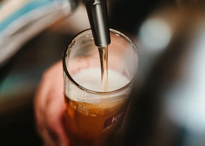 Person pouring a drink 