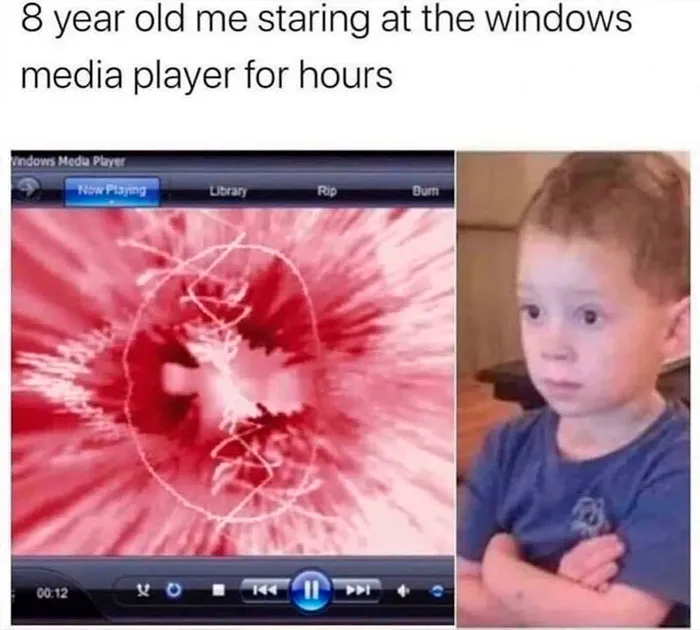 Child amazed by colorful Windows Media Player visualizer, with arms crossed, reminiscent of important images from childhood.