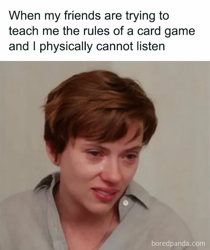 Person looking emotional while struggling to learn card game rules, a spicy meme to spice up your day with humor.