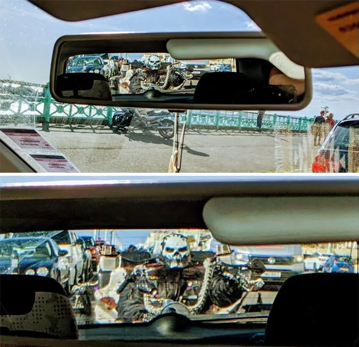 Person seeing a man with a weird costume on car's mirror 