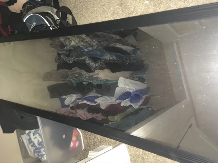 Mirror reflection in a closet of clothes 