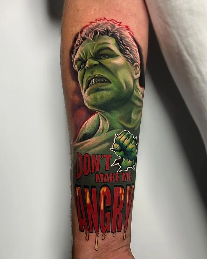 Marvel tattoo of the Hulk with "Don't Make Me Angry" text on a person's arm.