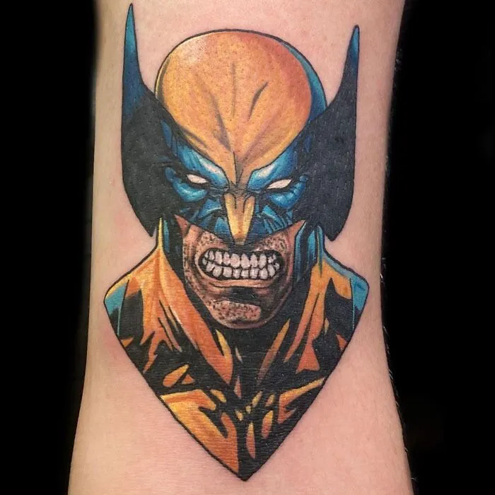 Wolverine tattoo showcasing vibrant colors and fierce expression on forearm, a tribute to Marvel.