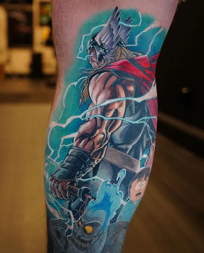 Marvel tattoo of Thor with Mjolnir and lightning on a leg, showcasing vibrant colors and dynamic design.