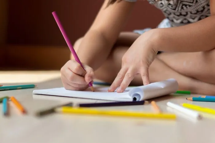 A kid drawing something 