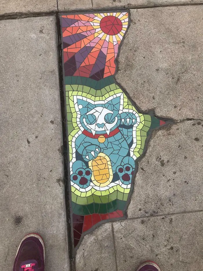 Tile Was Used To Fill This Crack In The Concrete Artistically