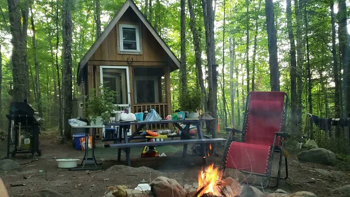 Located On Top Of A Hill, In The Middle Of A Forest