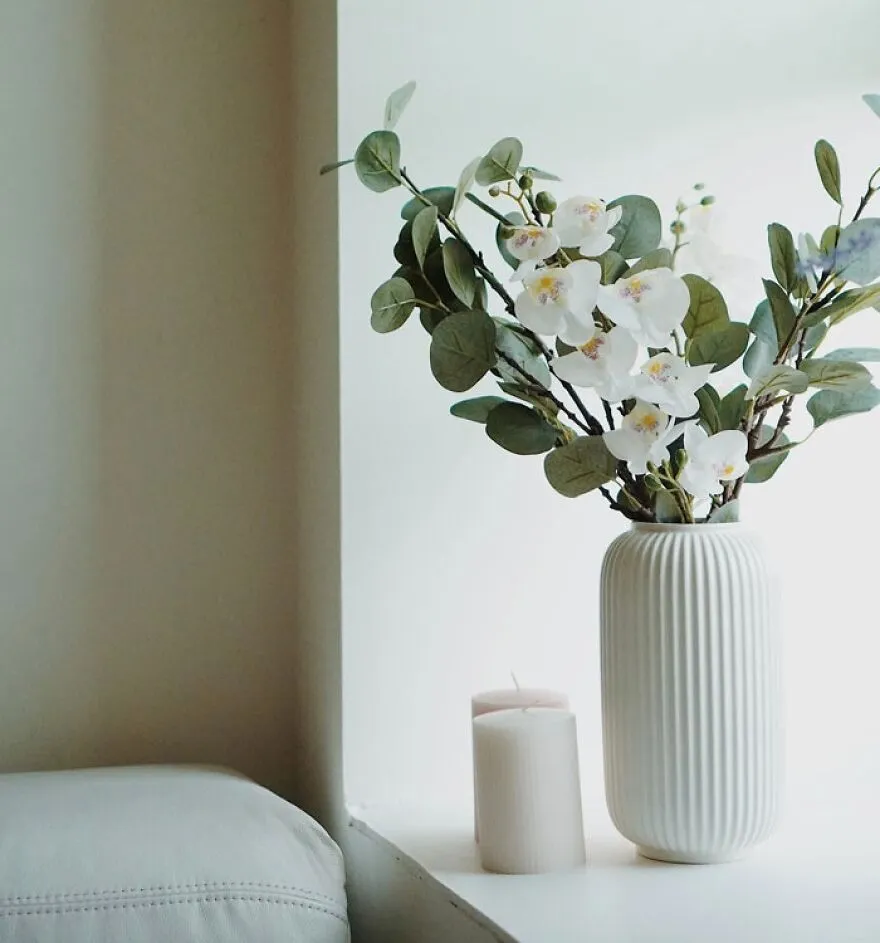 White vase with flowers 