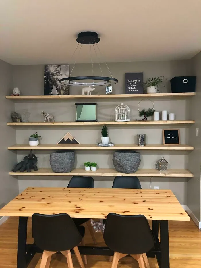 Wooden table with black chairs 