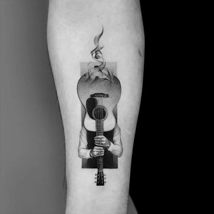 Smoking Guitar Forearm Tattoo