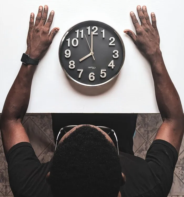 Man Sitting And Watching The Time 
