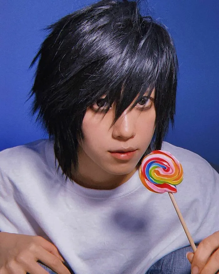 Person cosplaying L from Death Note