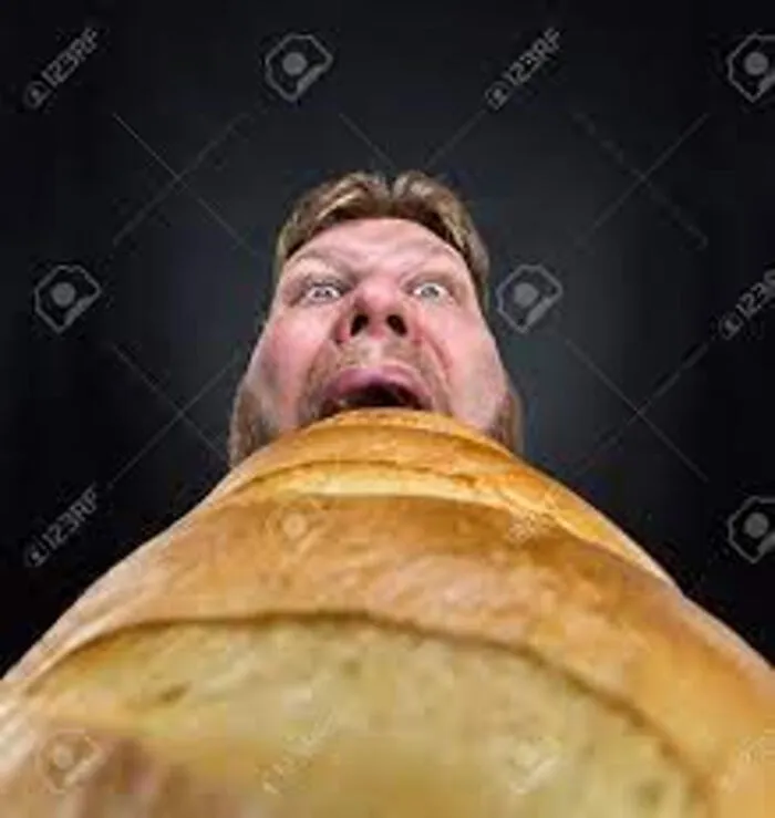 Guy Eating Bread? I Think?